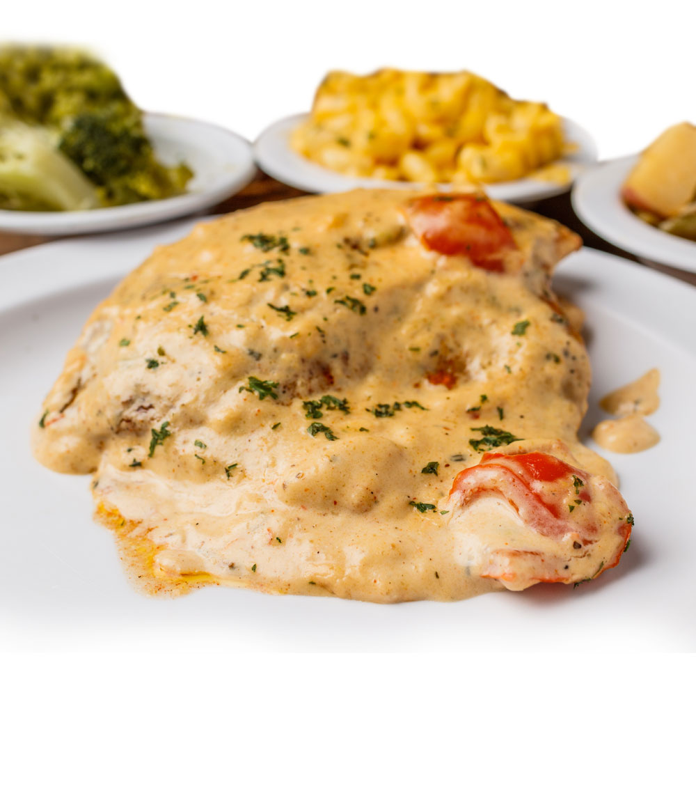 Indulge in our Alfredo tilapia, featuring flaky tilapia fillets topped with a rich and creamy Alfredo sauce for a deliciously decadent twist.