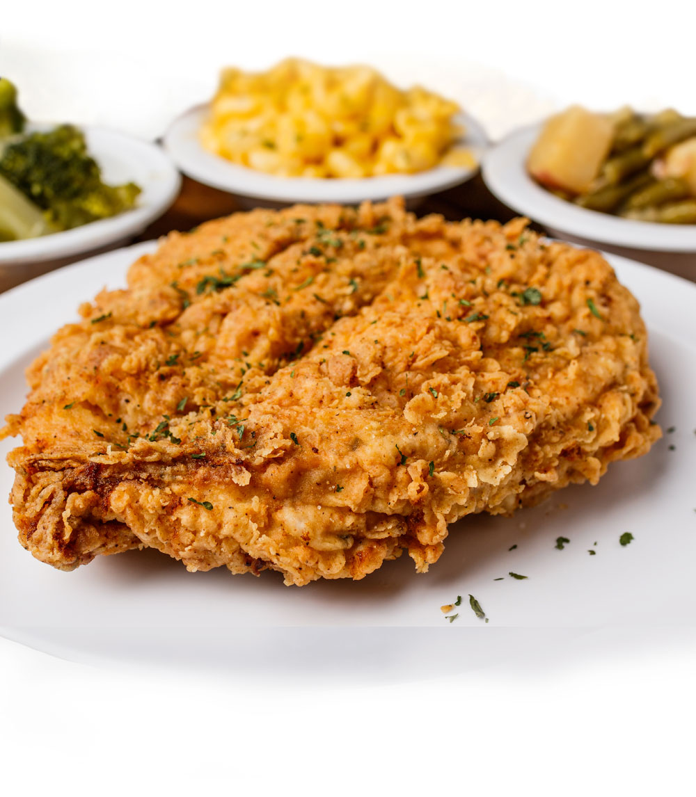 Indulge in our chicken fried chicken, featuring crispy fried chicken breasts smothered in creamy gravy for a soul-satisfying dish.
