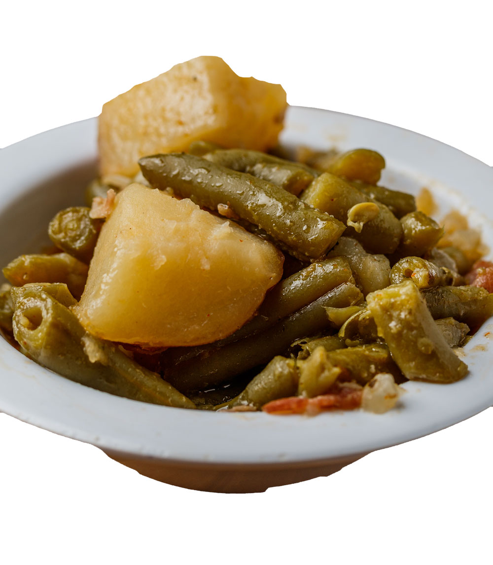 Savor the comfort of our green beans with bacon and potatoes, a hearty side that brings together the perfect blend of flavors in every bite.