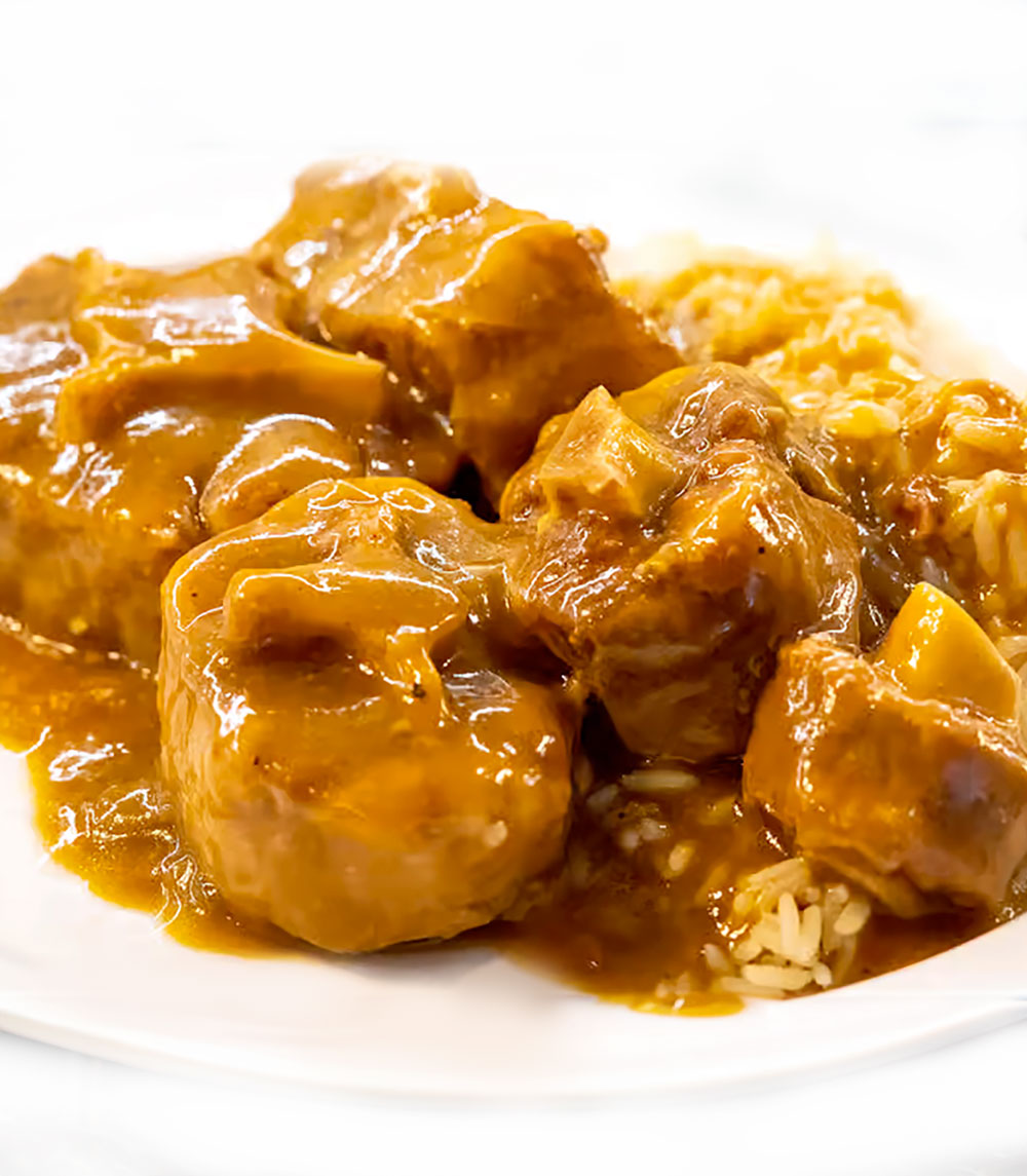 A plate of tender and flavorful Ox Tails, braised in a rich, savory gravy.