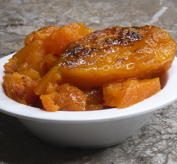 Treat yourself to our sweet and tender candied yams, cooked in a rich syrup of spices for a deliciously indulgent side.
