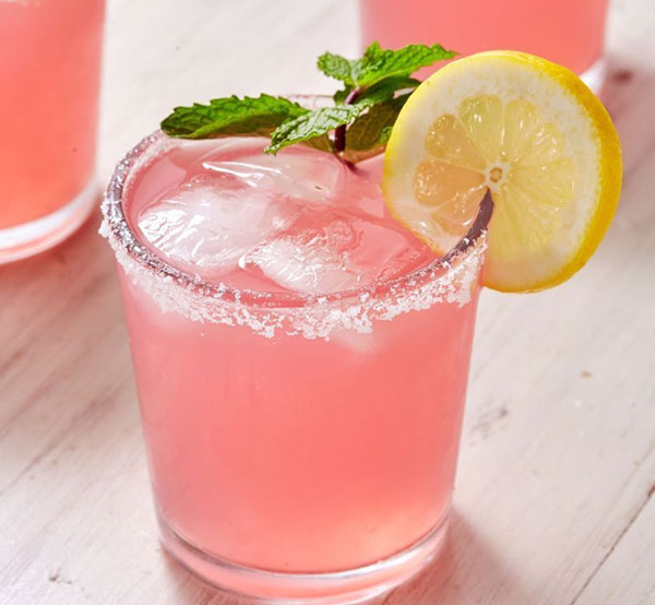 A Cotton Candy cocktail made with white vodka, tropical juices, and grenadine, served chilled for a sweet treat.