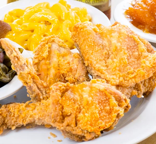 Indulge in our fried chicken, perfectly seasoned and fried to a golden crisp, delivering that classic soul food flavor you crave.