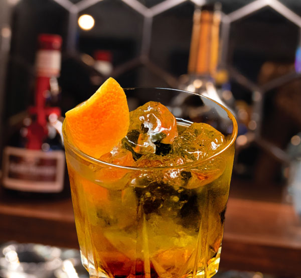 A sophisticated God Father cocktail made with scotch and amaretto, served over ice for a smooth finish.