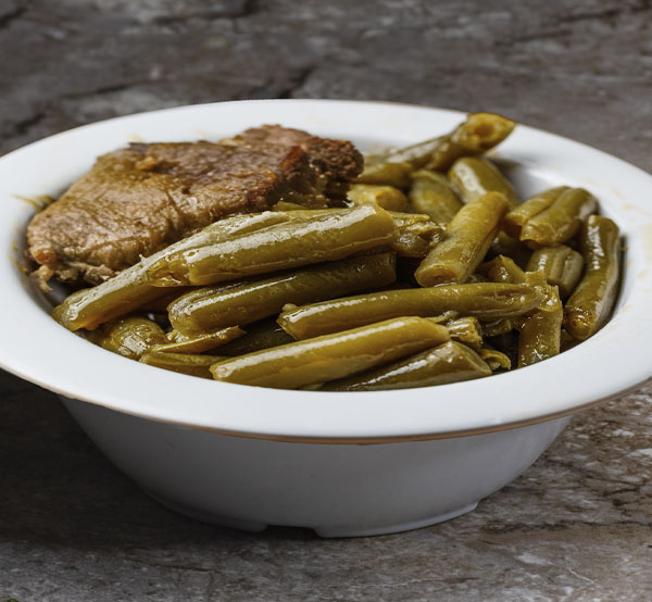 Experience the rich flavors of our green beans with smoked turkey, a savory side that adds a touch of Southern goodness to your meal.