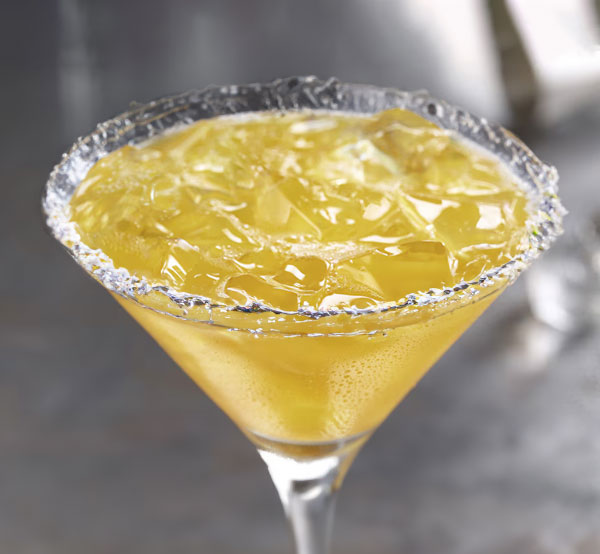 A refreshing classic margarita made with tequila, lime juice, and orange juice, served on the rocks with a salted rim.