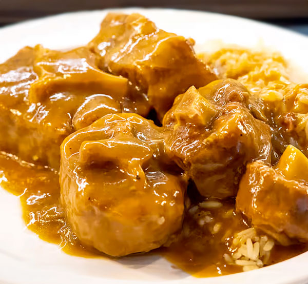 A plate of tender and flavorful Ox Tails, braised in a rich, savory gravy.