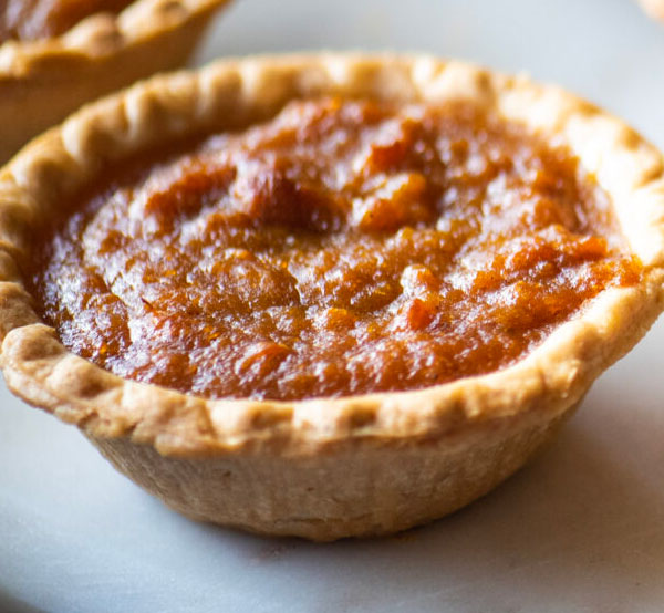 Classic sweet potato pie with a smooth, spiced filling and a flaky crust, embodying the flavors of the South.