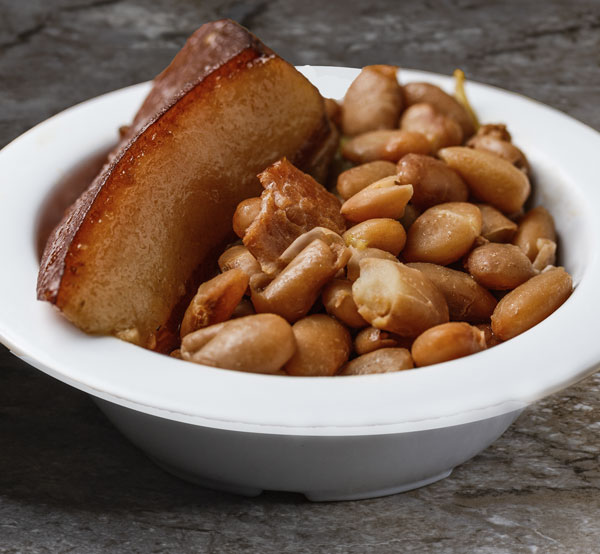 Savor our pinto beans, slow-cooked to perfection with savory spices and a touch of smoked meat for a hearty and flavorful side dish that embodies Southern comfort.