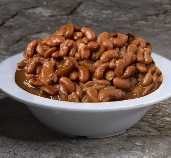 Enjoy a hearty bowl of red beans, slow-cooked to perfection with savory spices.