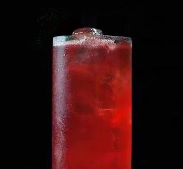 A vibrant Red Diva cocktail made with white Bacardi rum, cranberry juice, lime juice, and simple syrup, served over ice.