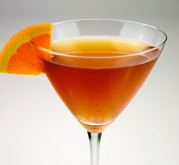 A classic Sidecar cocktail made with cognac, triple sec, Grand Marnier, and fresh lemon juice, served in a chilled glass.