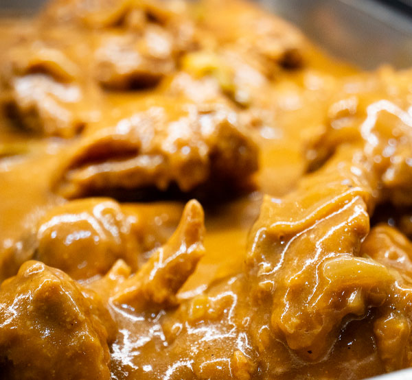 Indulge in our smothered fried chicken, perfectly crispy on the outside and tender on the inside, drenched in a rich, savory gravy that will have you coming back for more.