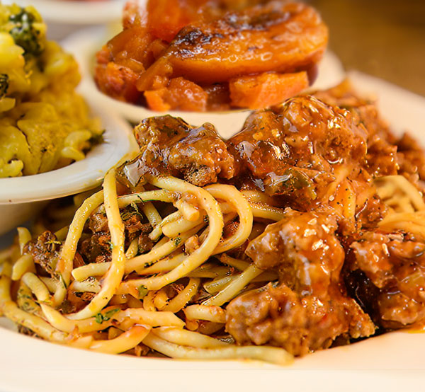Plate of freshly cooked spaghetti with ground beef Feel free to modify it to better fit your website's style!