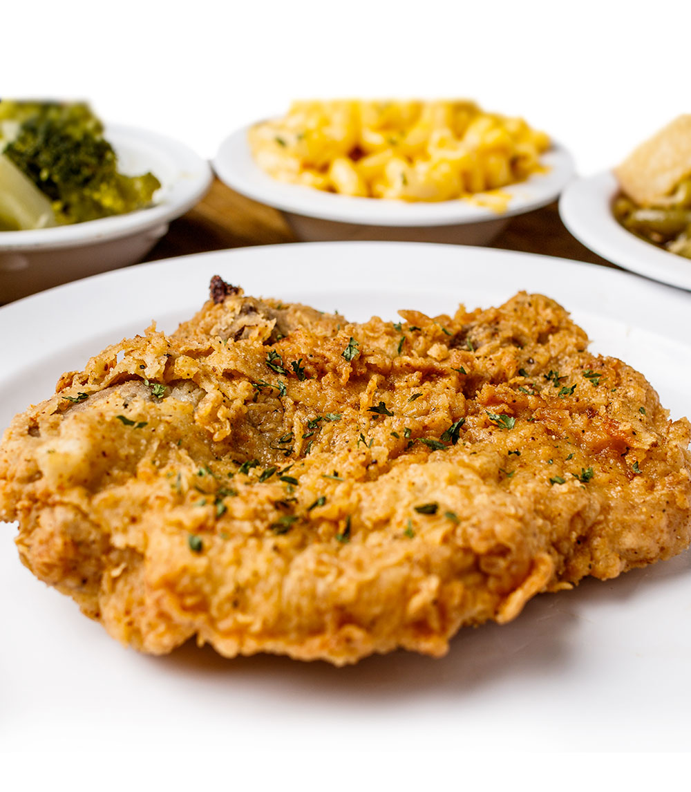 Savor our fried pork chops, perfectly seasoned and fried to a crisp golden brown, delivering a mouthwatering crunch with every bite.