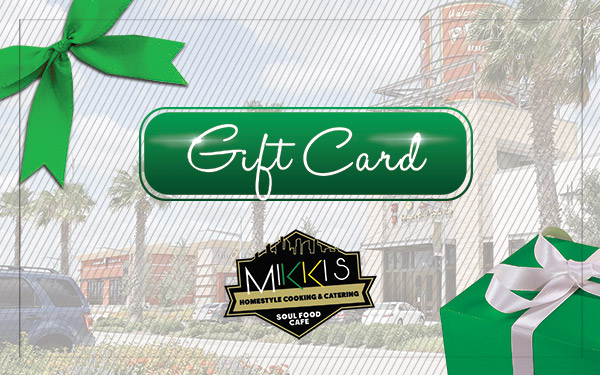 Gift card for a soul food restaurant displayed on a wooden table background.