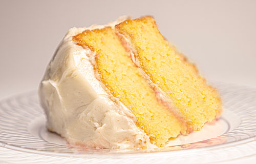 Moist lemon cake layered with tangy lemon frosting, delivering a refreshing burst of citrus in every bite.