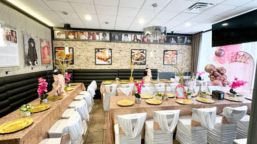 Elegant private dining room set for an event, featuring comfortable seating arrangements for up to 45 guests