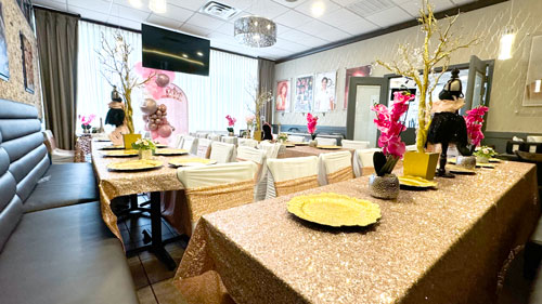 Elegant private dining room set for an event, featuring comfortable seating arrangements for up to 45 guests