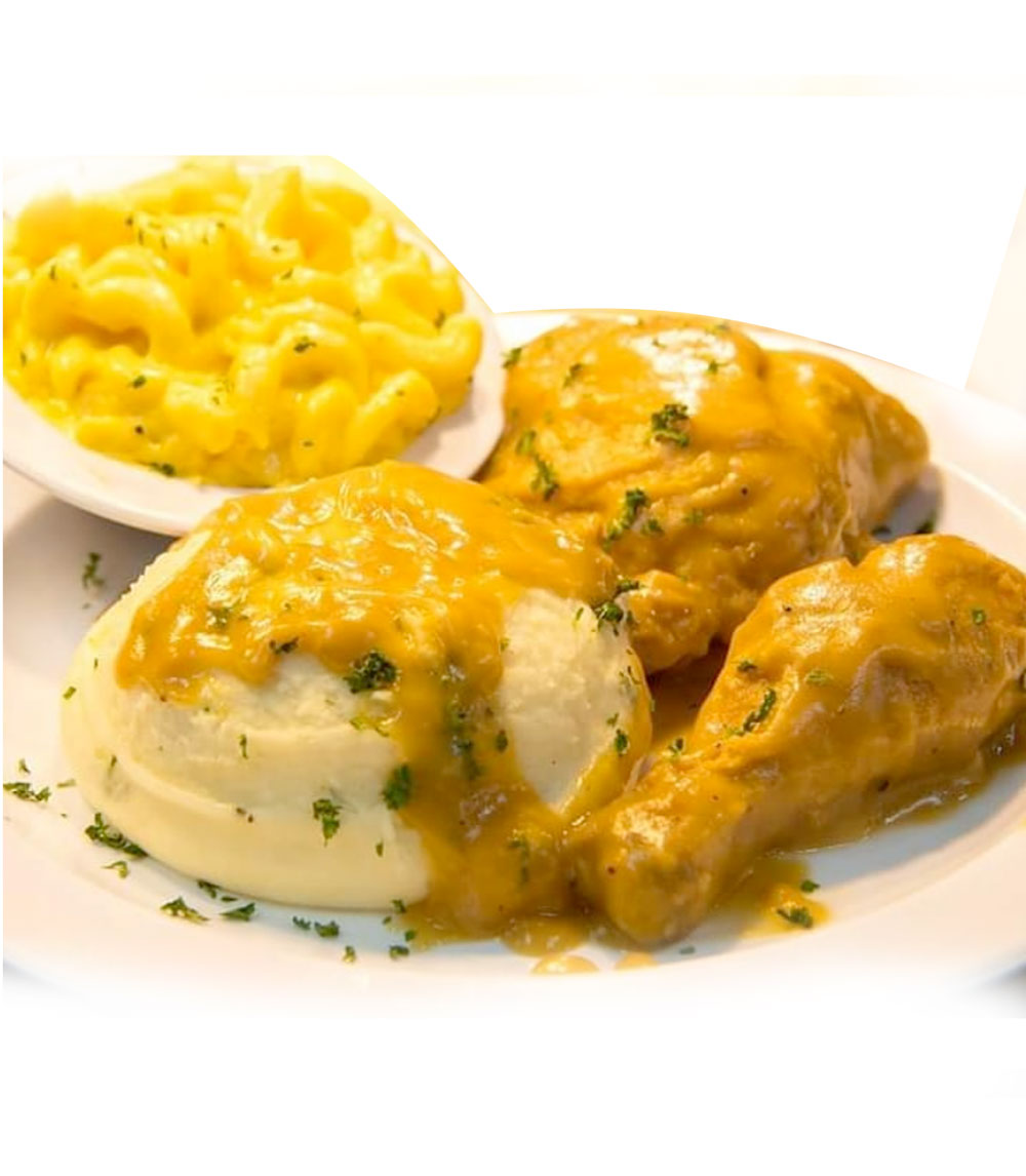 Indulge in our smothered fried chicken, perfectly crispy on the outside and tender on the inside, drenched in a rich, savory gravy that will have you coming back for more.